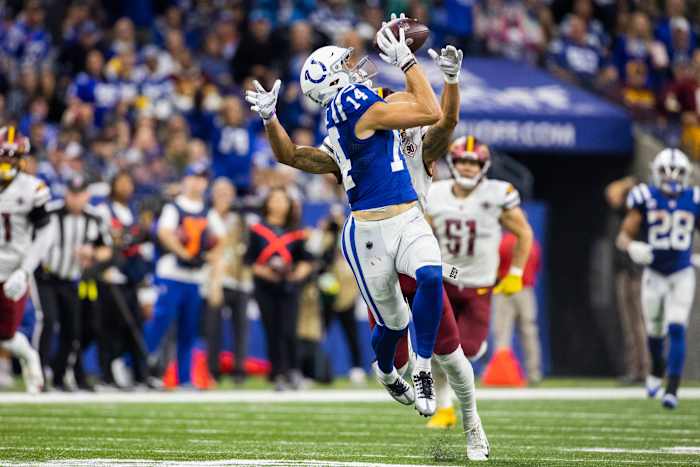 Oct 30, 2022; Indianapolis, Indiana, USA; Indianapolis Colts wide receiver Alec Pierce (14) catches the ball while Washington Commanders cornerback Benjamin St-Juste (25) defends in the second half at Lucas Oil Stadium.